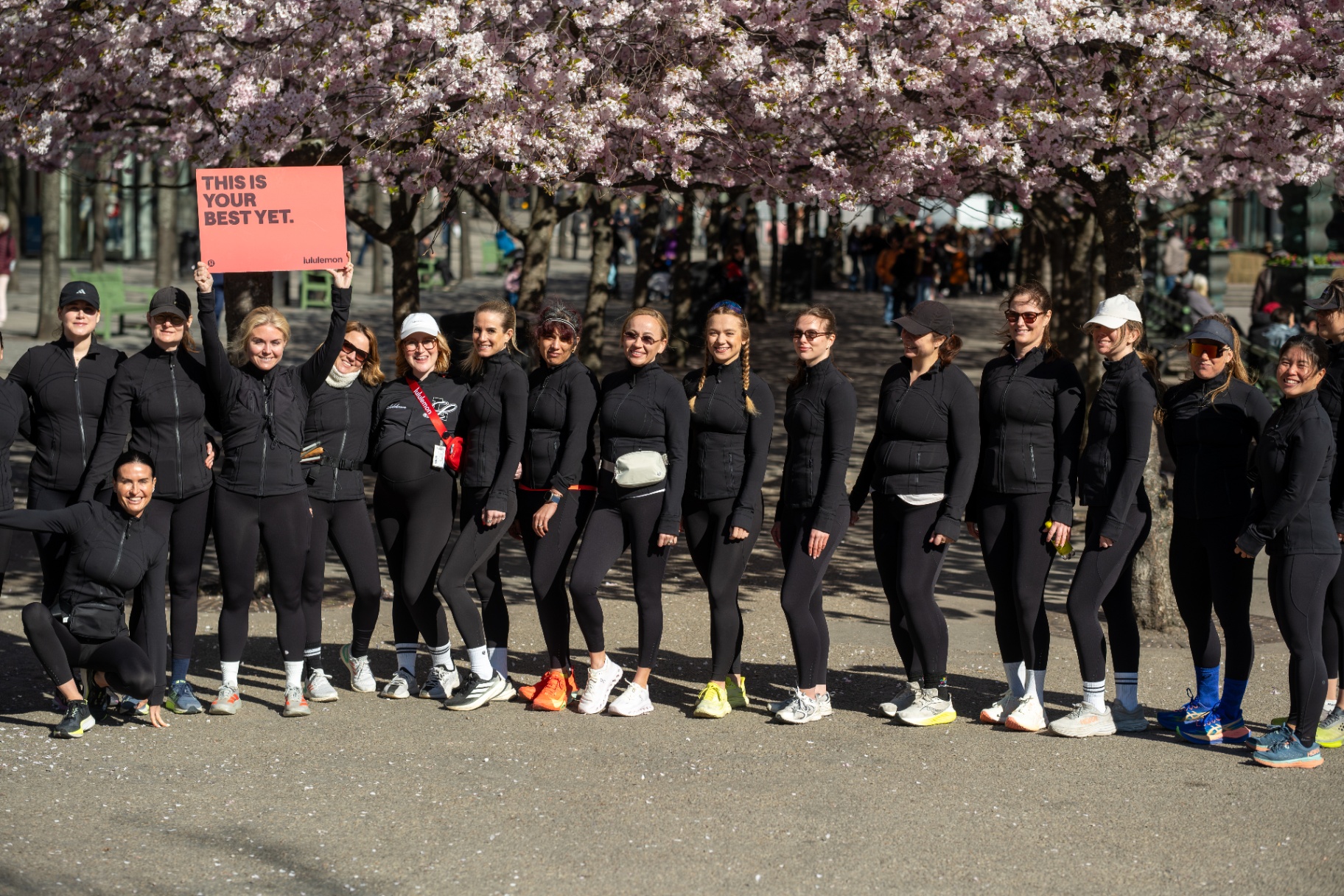 Femme Open run club beneath cherry blossoms in Stockholm